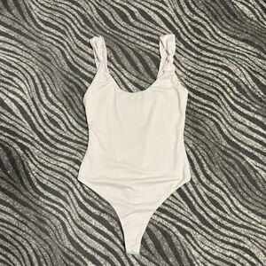 For love and lemons tan medium thong bodysuit in great condition!